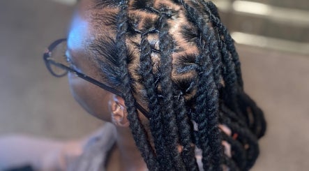 Close-up of detailed braids at Ttee Da Goat Stylez, North Charleston, South Carolina, US, showcasing expert styling.