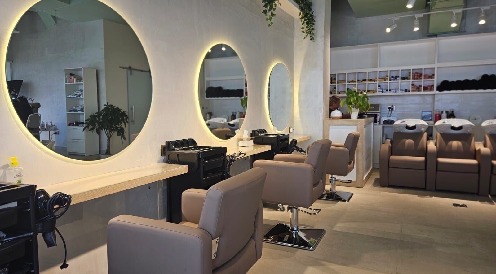 Chic interior of Salon No9 in Dubai, Dubai, AE featuring stylish seating and illuminated mirrors.