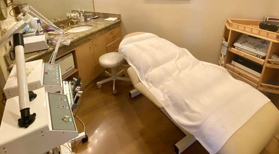 Tranquil spa treatment room at Classy Hair Salon, Gardena, California, US, featuring a plush treatment bed.
