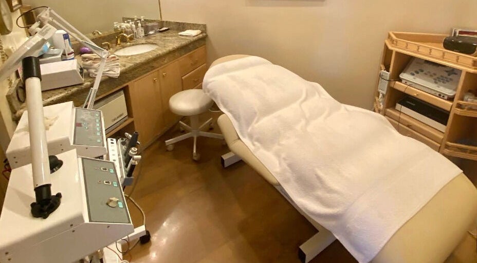 Tranquil spa treatment room at Classy Hair Salon, Gardena, California, US, featuring a plush treatment bed.