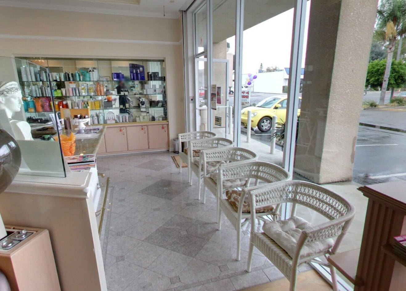 Inviting waiting area at Classy Hair Salon in Gardena, California, US, featuring stylish seating and modern decor.