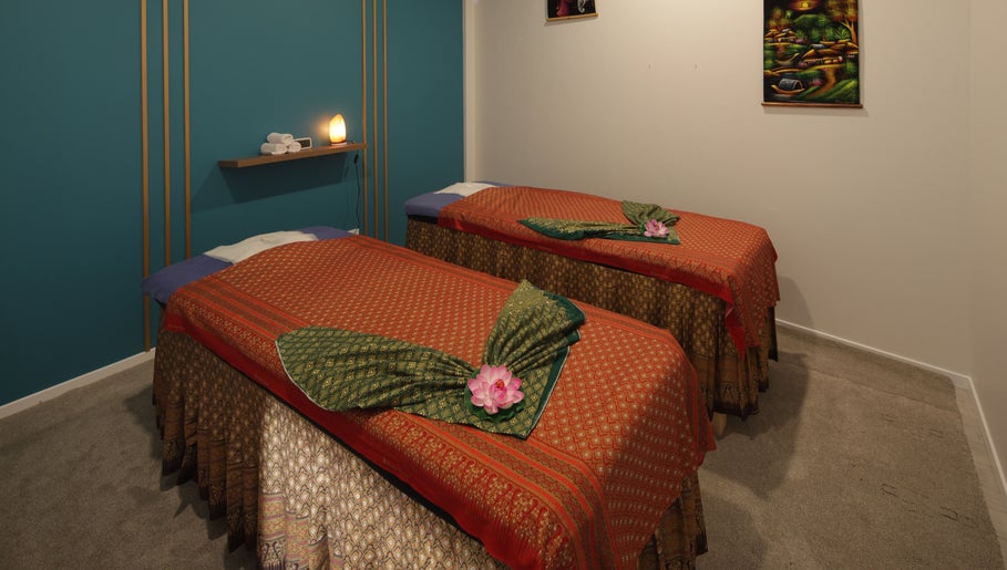 Twin massage beds at Naree Thai Massage in Auckland, NZ, featuring elegant decor and calming ambiance.