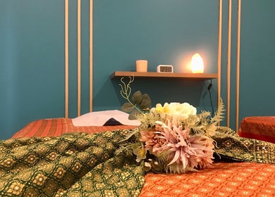 Elegant massage room with floral decor at Naree Thai Massage, Auckland, NZ exuding tranquility.