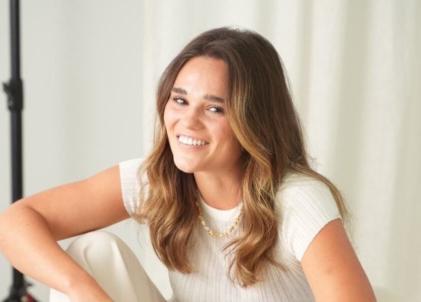 Smiling person at Tory Wells, Mascot, New South Wales, AU, exuding warmth and relaxation.