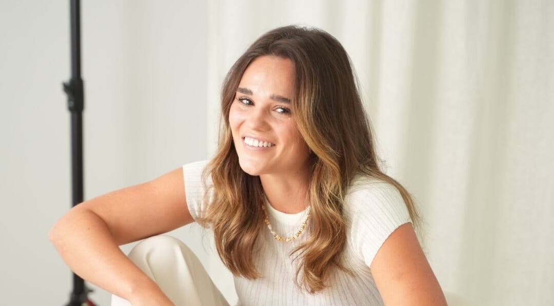 Smiling person at Tory Wells, Mascot, New South Wales, AU, exuding warmth and relaxation.