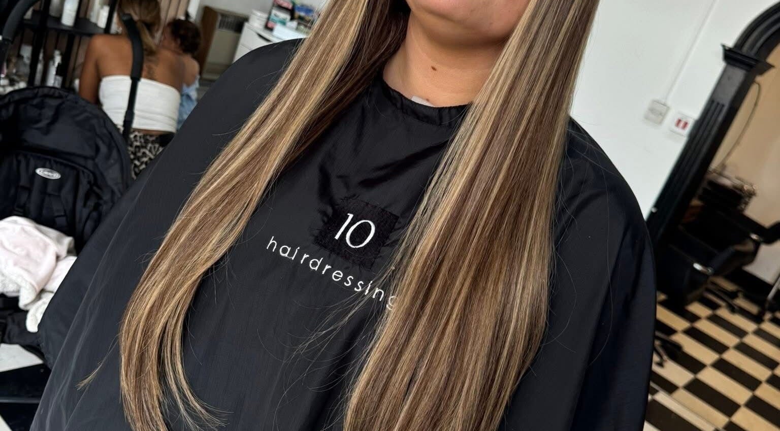 Long, sleek hair styled at NNC Hair&Beauty in Hull, England, GB. Perfectly straightened with blonde highlights.