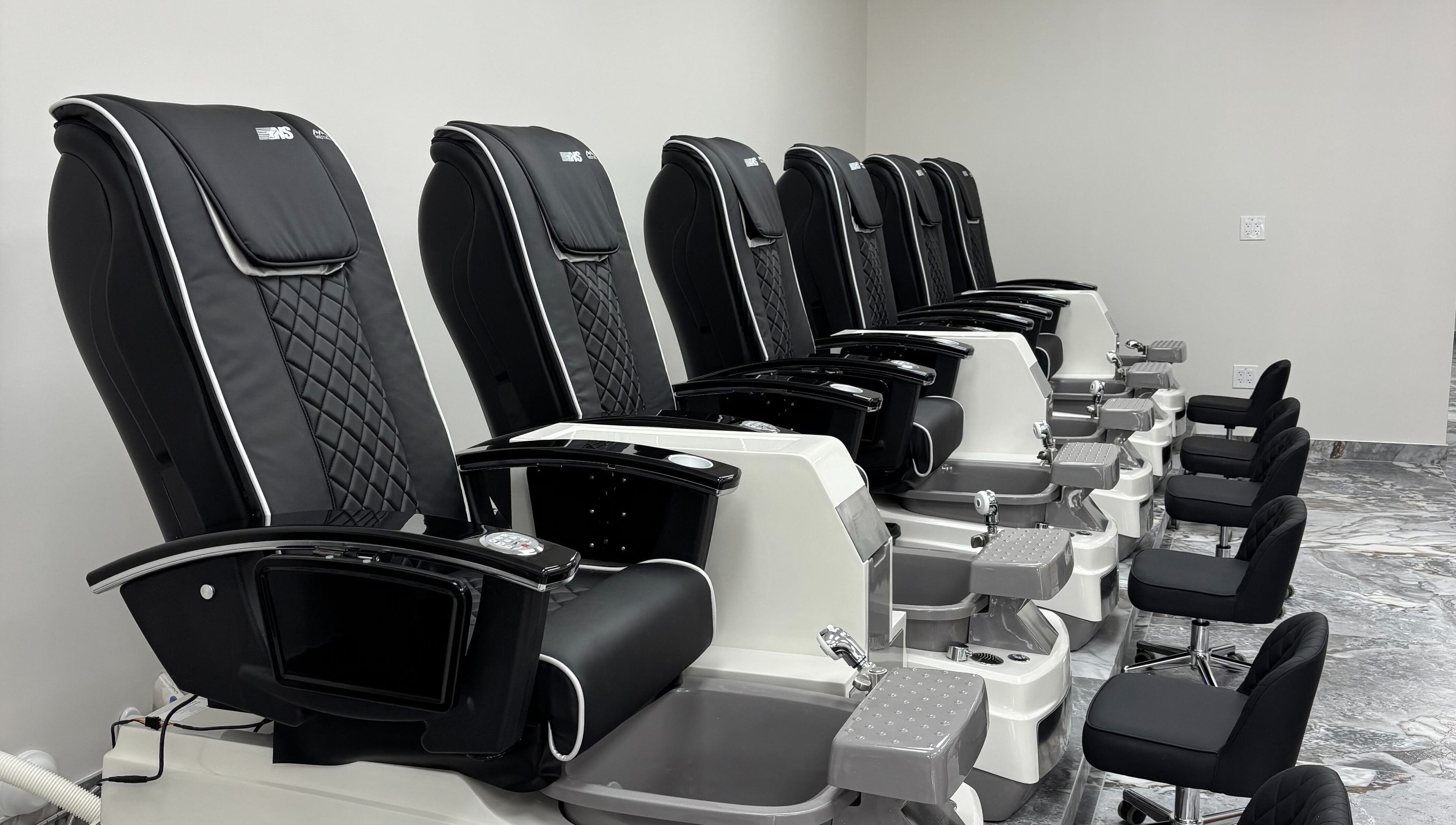 Elegant pedicure chairs at Vogue Lashes & Spa - Great Bridge, Chesapeake, Virginia, US offer comfort and style.