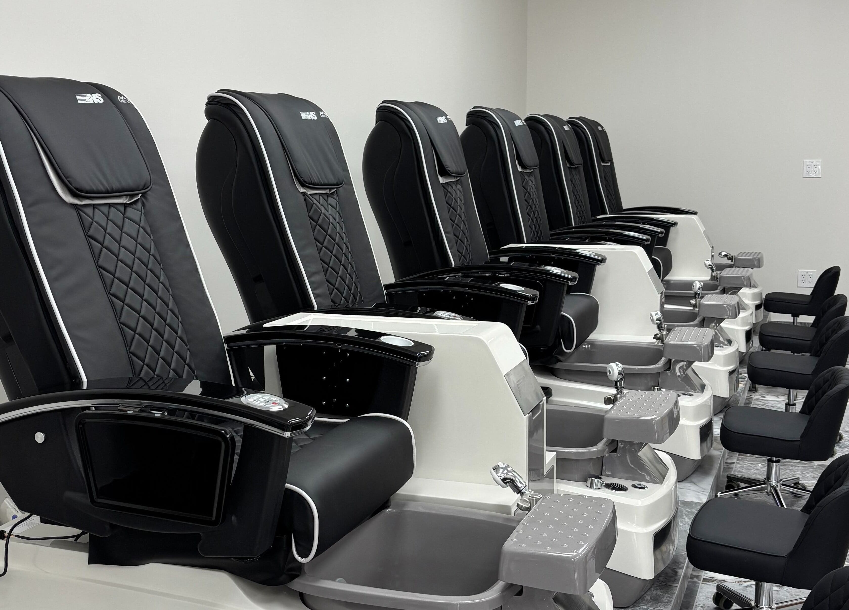 Elegant pedicure chairs at Vogue Lashes & Spa - Great Bridge, Chesapeake, Virginia, US offer comfort and style.