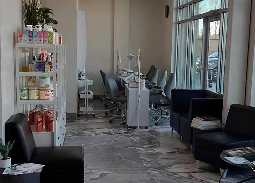 Modern interior of Vogue Lashes & Spa - Great Bridge in Chesapeake, Virginia, US, featuring sleek seating and product displays.