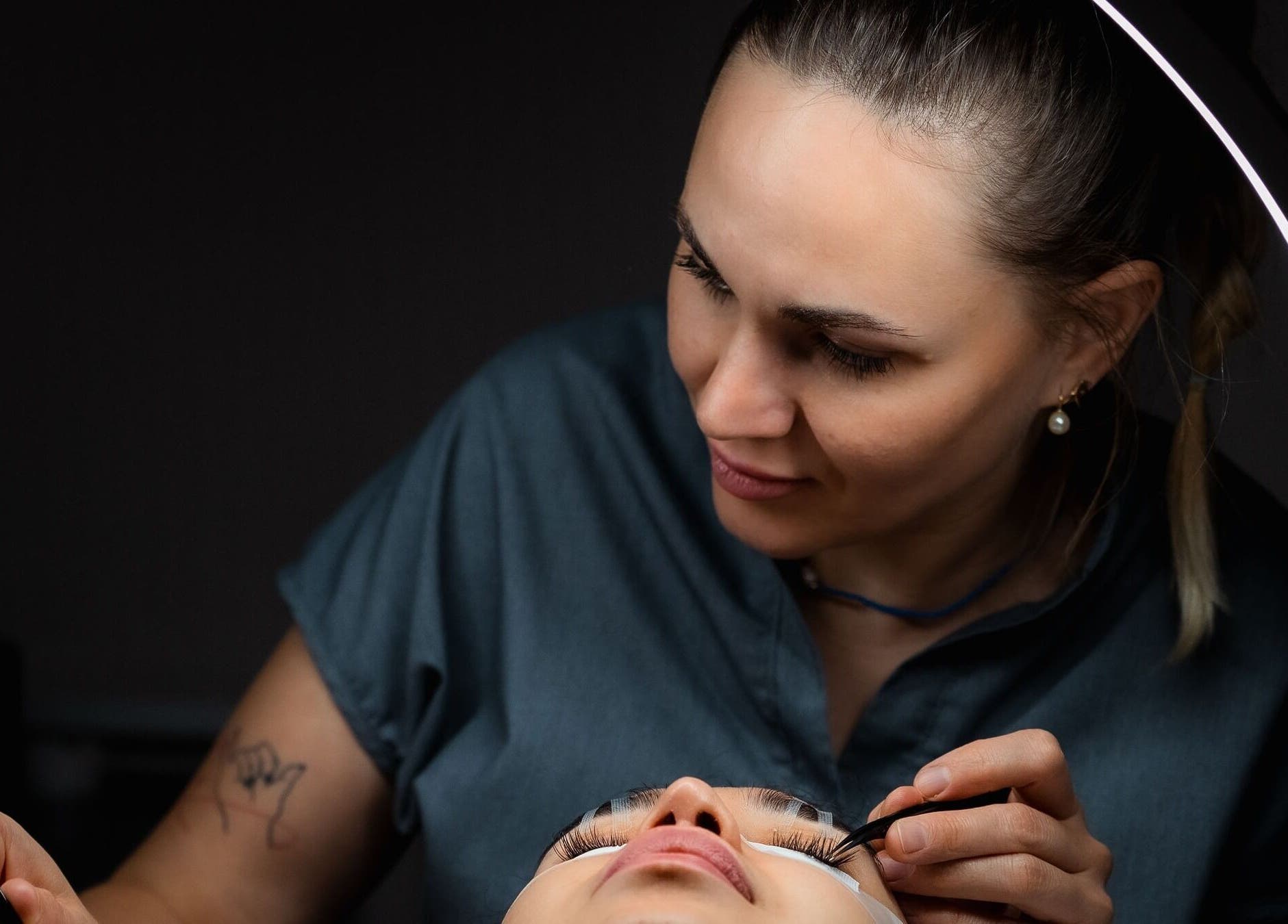 Vogue Lashes & Spa - Great Bridge expert beautician in Chesapeake applying luxurious eyelash extensions.