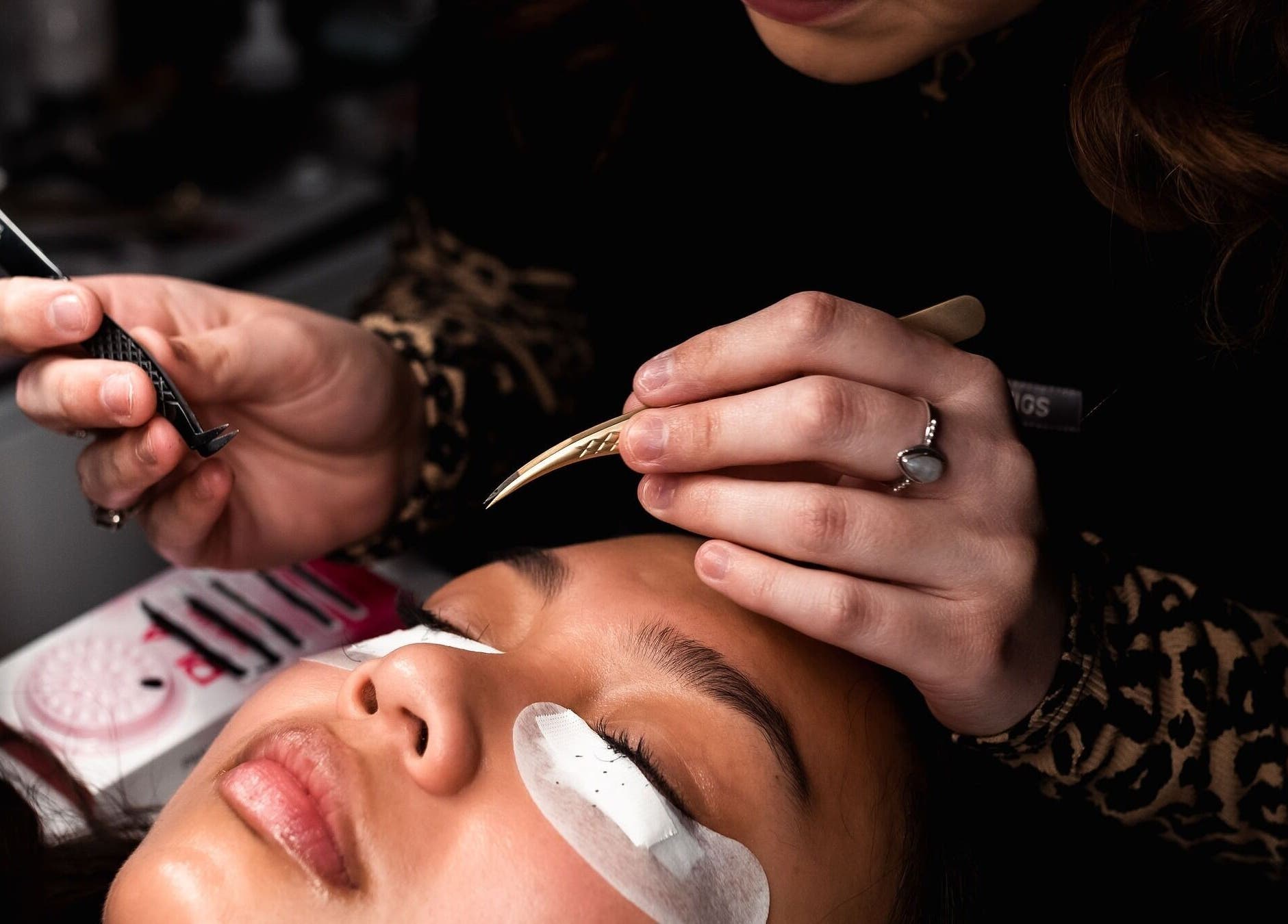 Expert performing eyelash extensions at Vogue Lashes & Spa - Great Bridge, Chesapeake, Virginia, US.