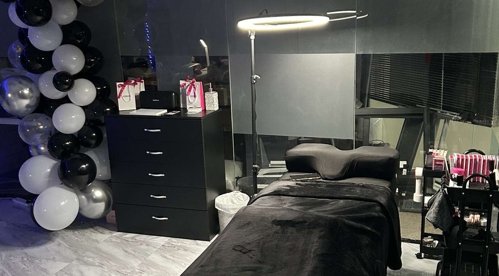 Lash’d aesthetics UK treatment room with black decor in Peterborough, England, GB.