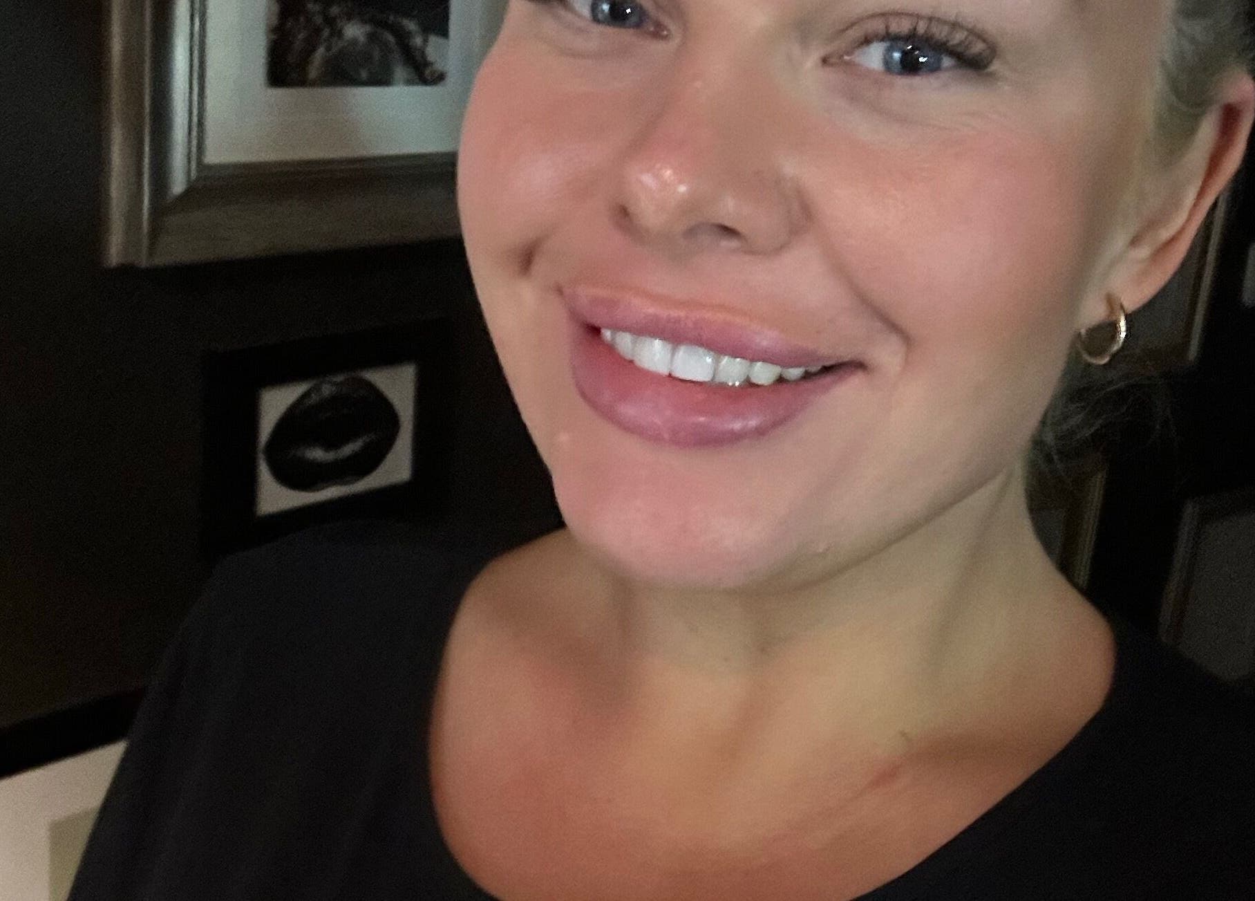 Smiling person at Daisy at Lash Queen - Edit Clinic, Bury St Edmunds, England, GB with elegant decor.