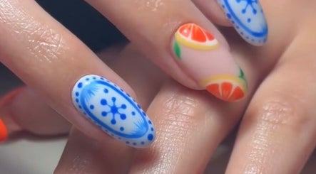 Detailed artistic nail designs at Edit By ELM, Binfield, England, GB showcasing vibrant blue and citrus patterns.