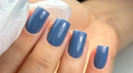 Elegant blue manicured nails at Edit By ELM, Binfield, England, GB showcasing sleek, glossy finish.