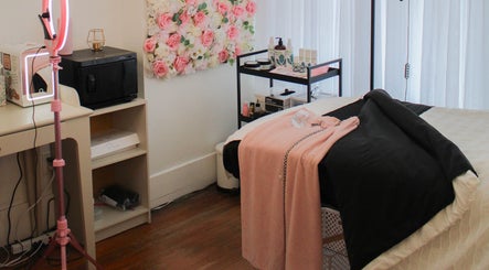 Tranquil treatment room in Get Up and Glow Beauty Studio, Chehalis, Washington, US, with floral decor and equipment.