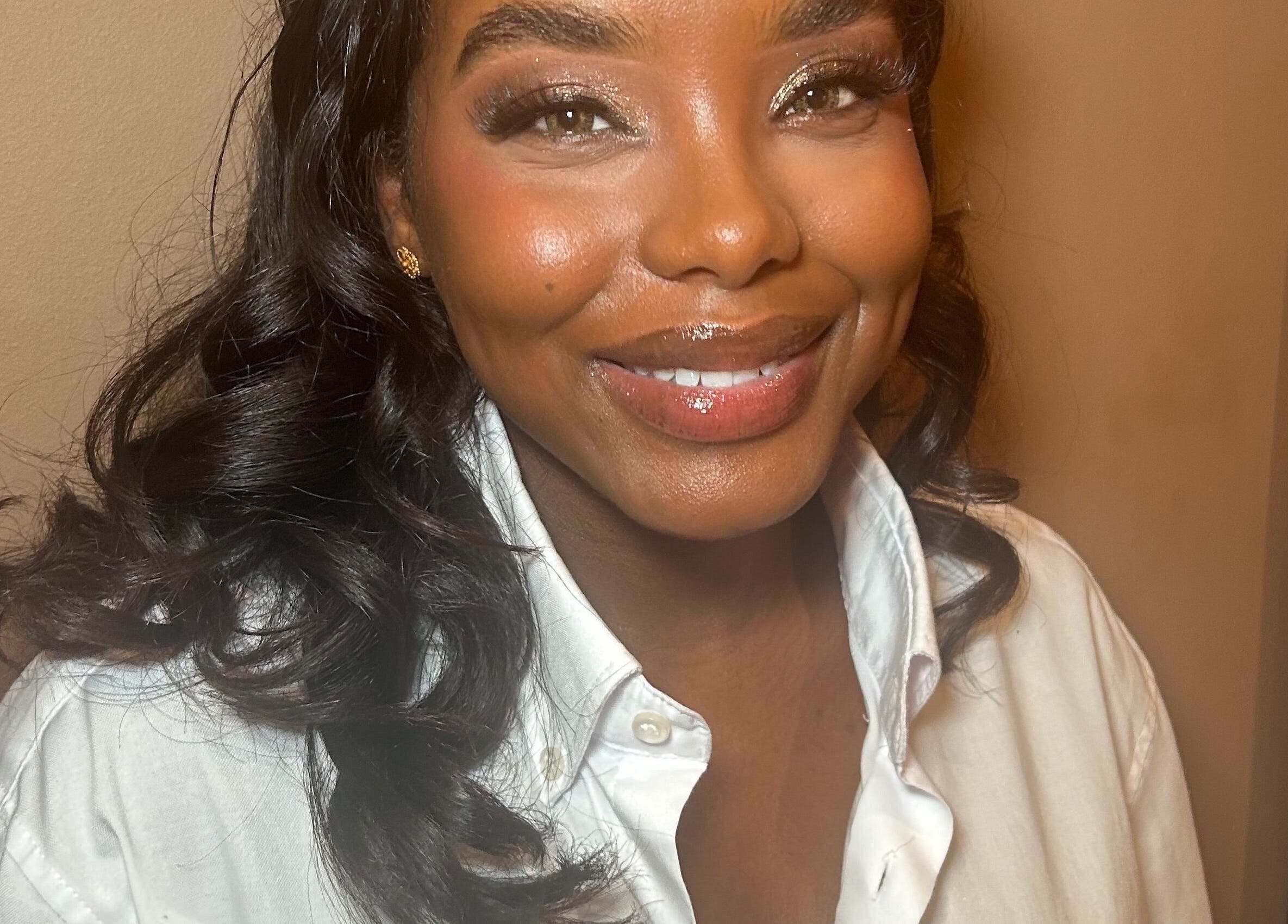 Person smiling warmly with styled hair at Hannah Kathleen in Birmingham, England, GB.