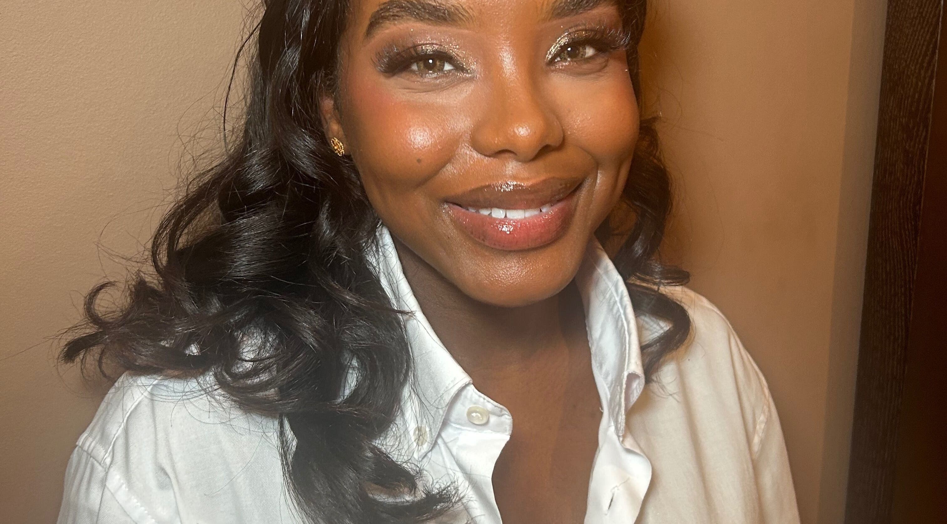 Person smiling warmly with styled hair at Hannah Kathleen in Birmingham, England, GB.