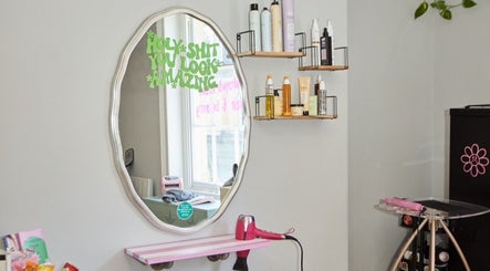 Modern salon vanity at Alice at Wonderlandcheltenham, Cheltenham, England, GB, showcasing beauty products.