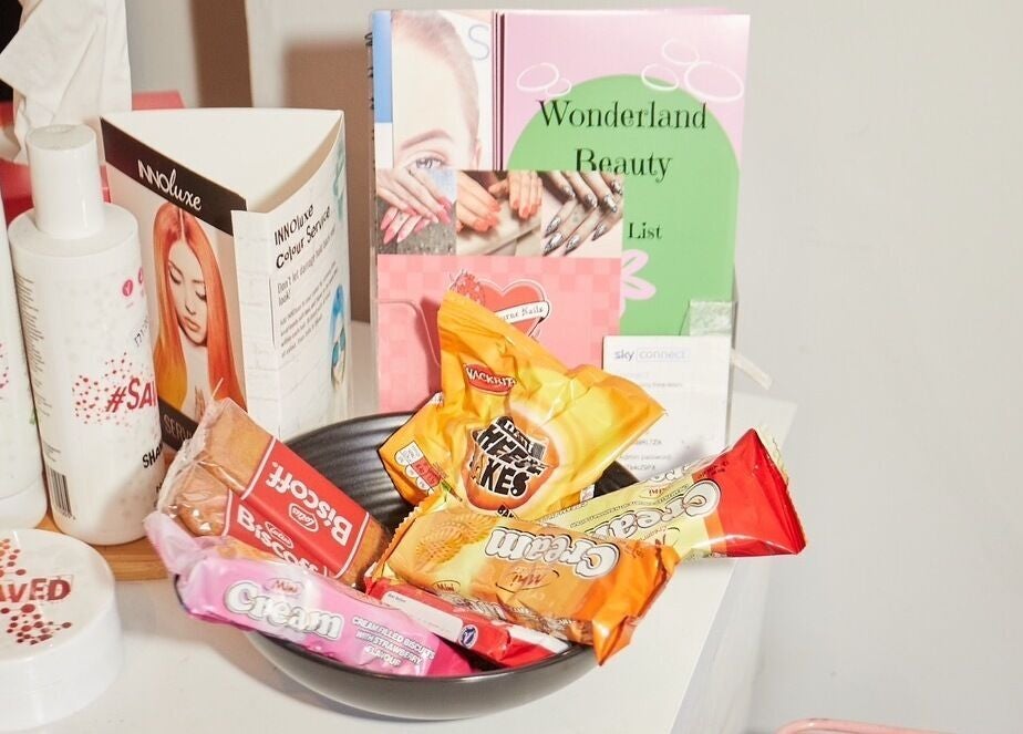 Display of beauty products and snacks at Wonderland Hair Cheltenham, Cheltenham, England, GB.