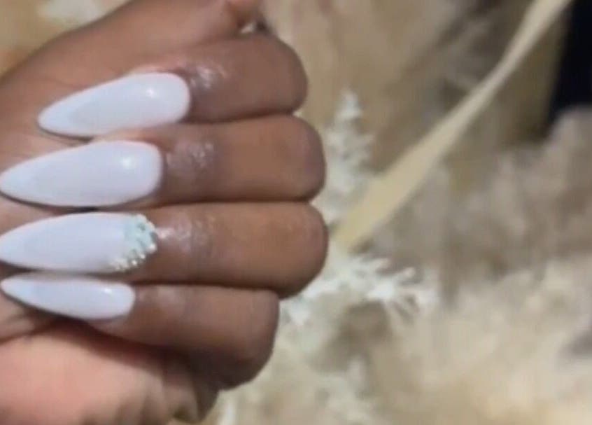 White almond nails with embellishment at Top Adi Line Nails, Old Harbour, St. Catherine Parish, JM.