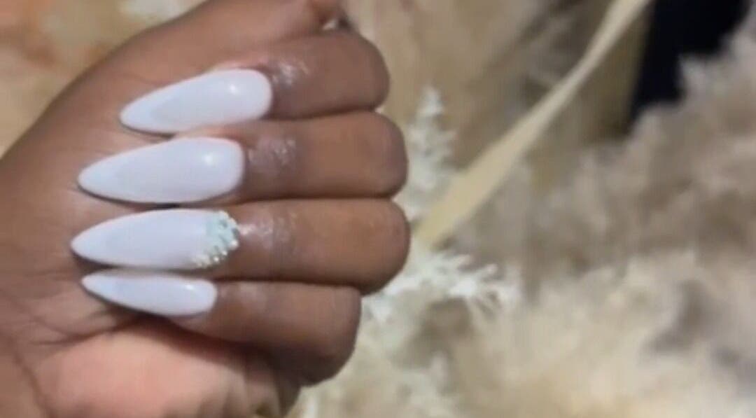 White almond nails with embellishment at Top Adi Line Nails, Old Harbour, St. Catherine Parish, JM.