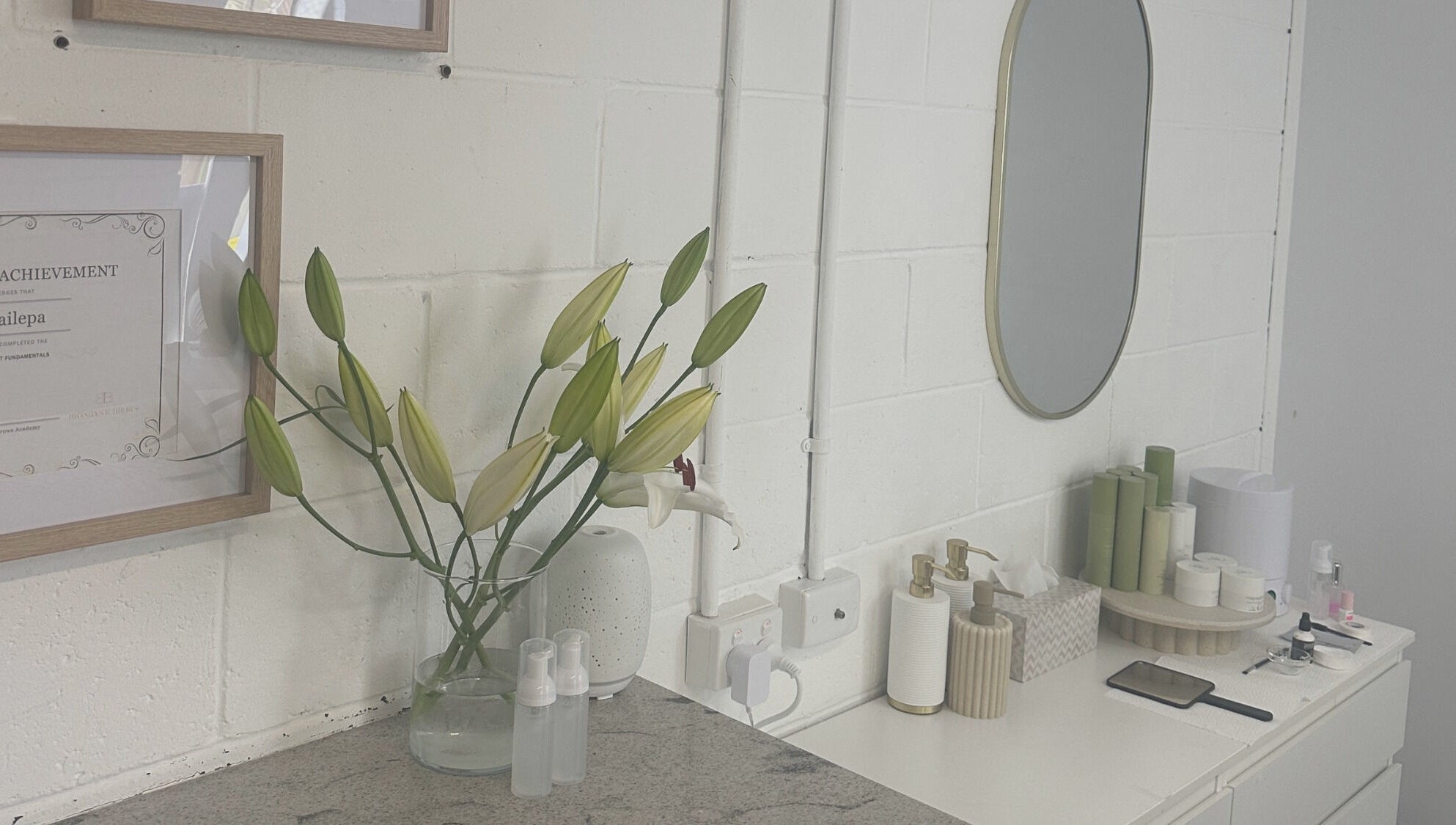 Elegant setup at Lmv Studio, Mermaid Waters, Queensland, AU, featuring lilies and beauty products.