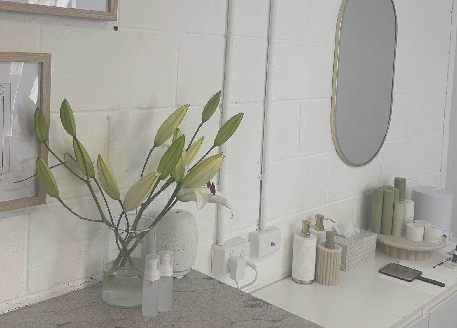 Elegant setup at Lmv Studio, Mermaid Waters, Queensland, AU, featuring lilies and beauty products.