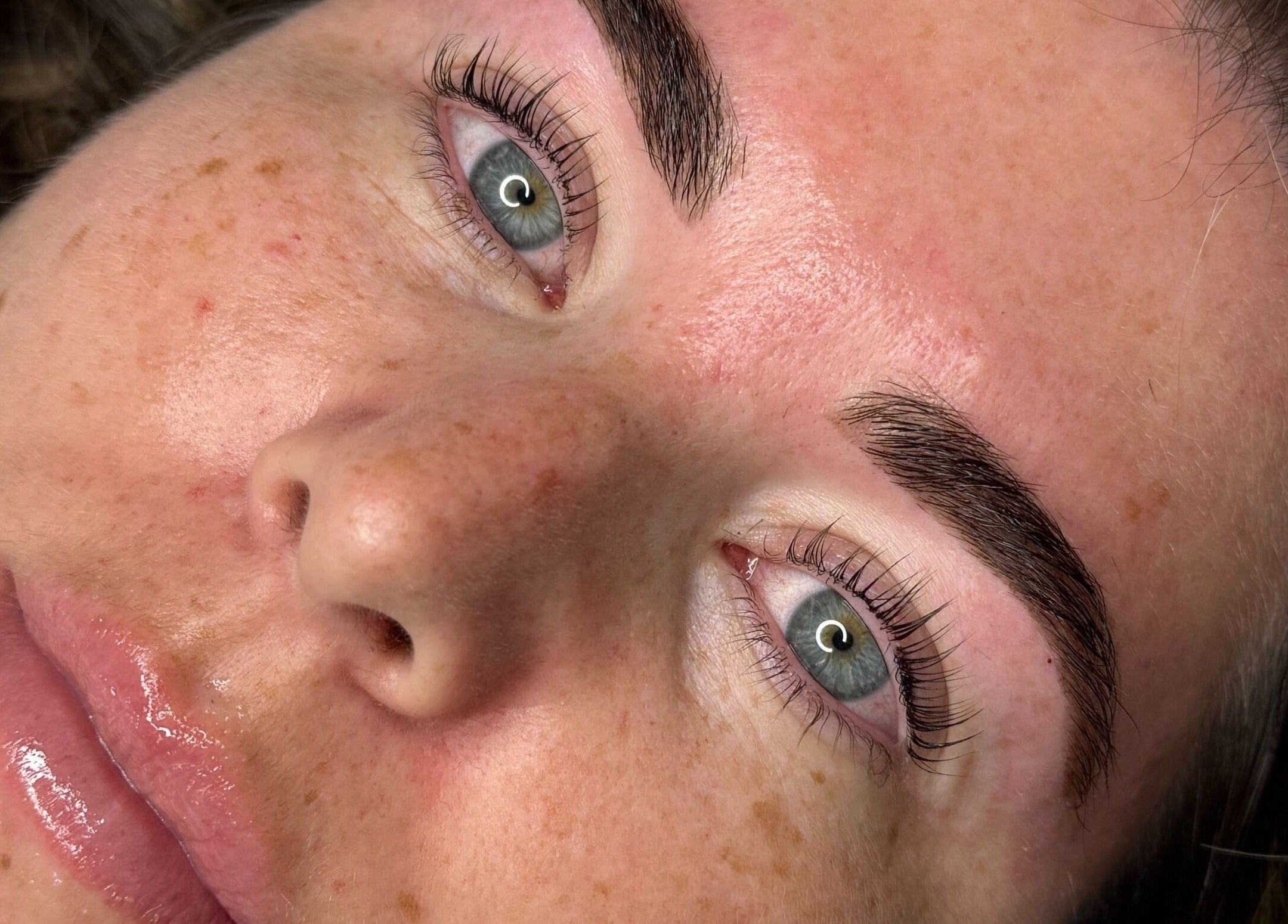 Close-up of a woman's flawless skin and groomed eyebrows at Lmv Studio, Mermaid Waters, Queensland, AU.