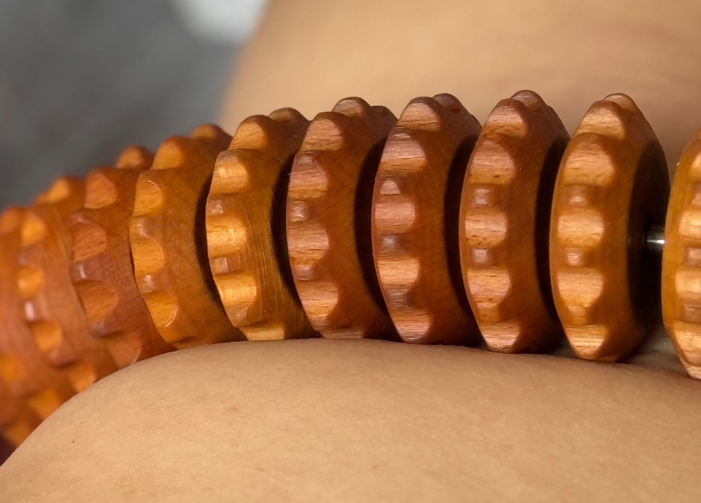 Wooden massage roller in use at Le Kare Spa - Home Service Jeddah, Jeddah, SA for a therapeutic experience.