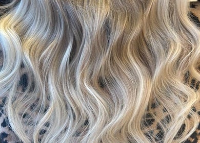 Stylish blonde waves from Sandi Hair Studio, Greater, Atherton, England, GB. Perfect for a chic look.