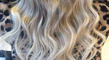 Stylish blonde waves from Sandi Hair Studio, Greater, Atherton, England, GB. Perfect for a chic look.