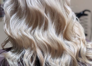 Beautiful wavy blonde hair styled at Sandi Hair Studio, Greater, Atherton, England, GB.