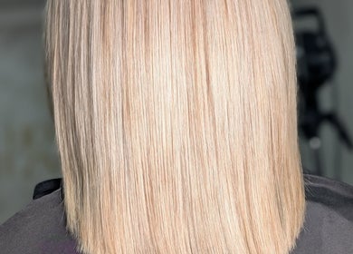Sleek blonde hairstyle at Sandi Hair Studio in Greater, Atherton, England, GB showcasing expert styling.
