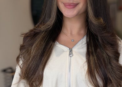 Beautiful long hair styled with soft waves at Sandi Hair Studio, Greater, Atherton, England, GB.