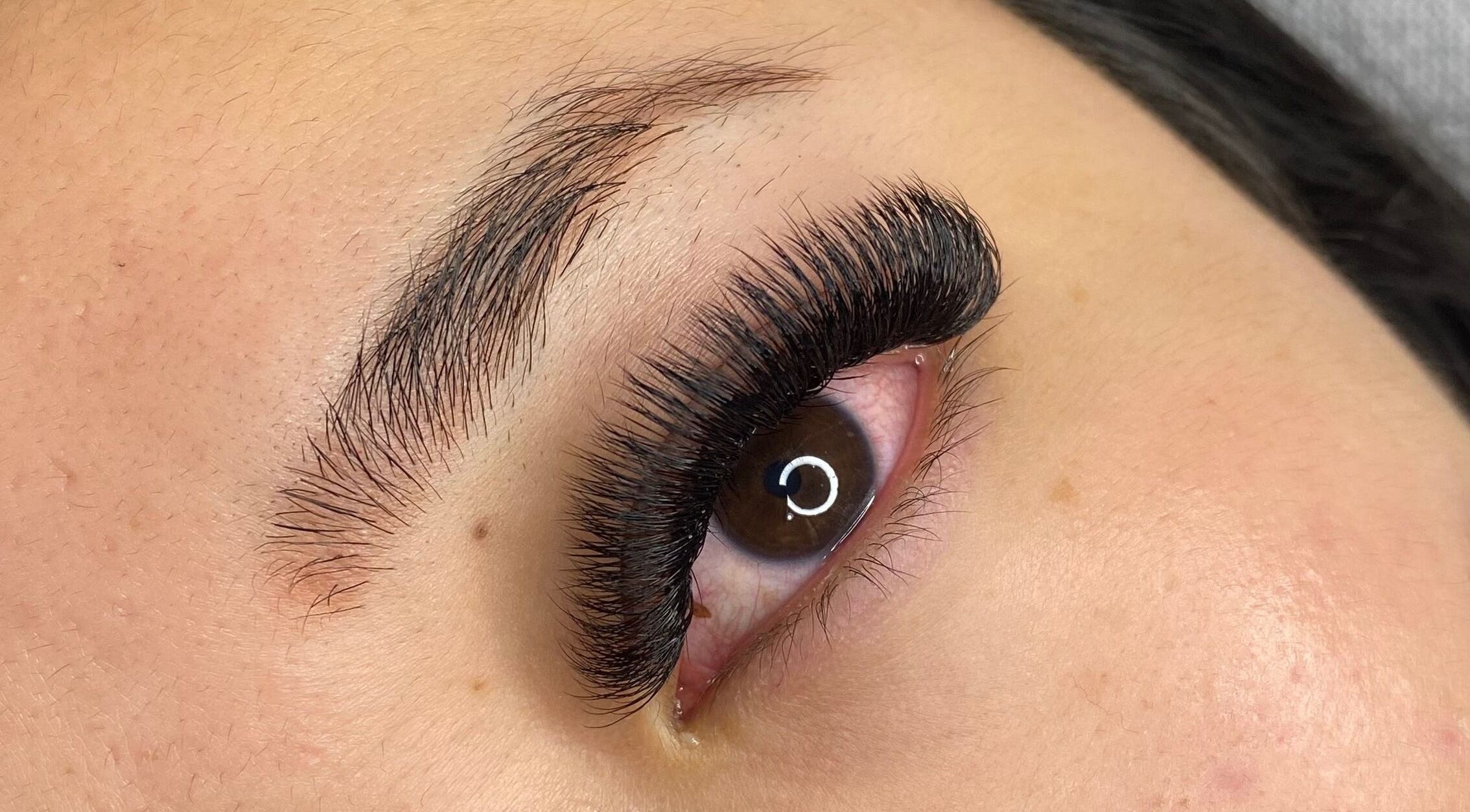 Close-up of expertly applied eyelash extensions at Lashed by Linda, Middleton Grange, New South Wales, AU.