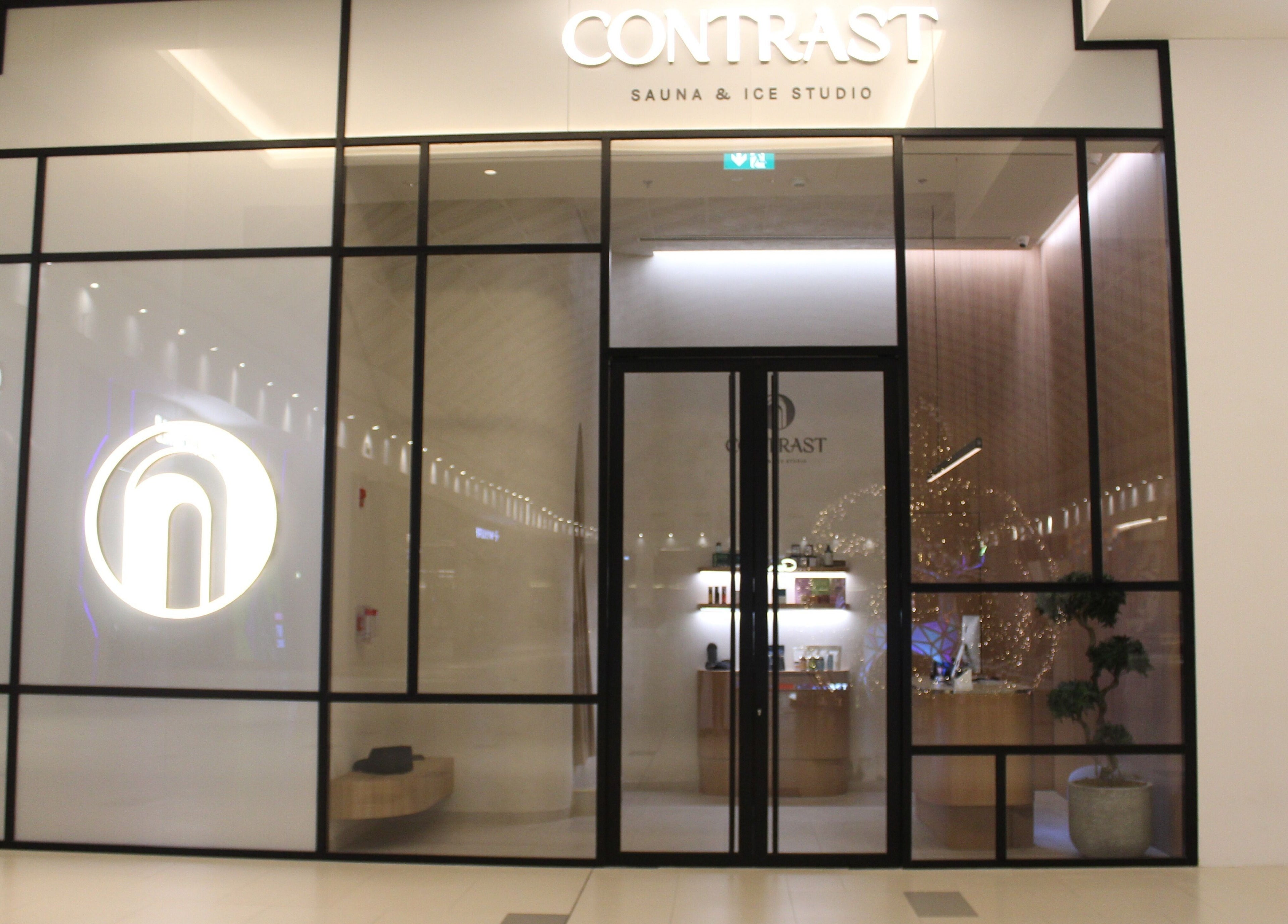 Front view of Contrast JVC, a modern sauna and ice studio in دبي, دبي, AE, showcasing its elegant glass facade.