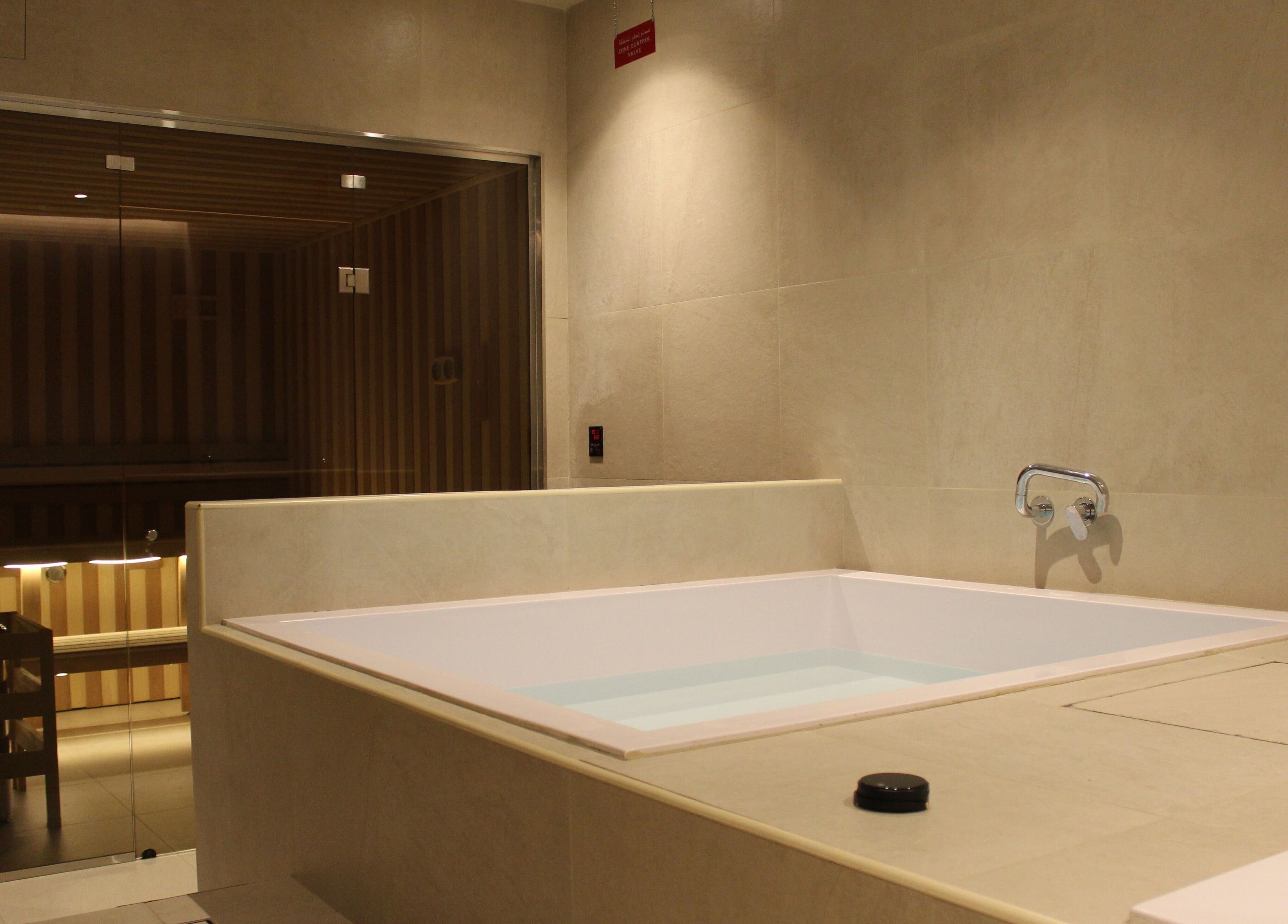 Luxurious spa bath and sauna at Contrast JVC, دبي, دبي, AE offering ultimate relaxation and wellness.