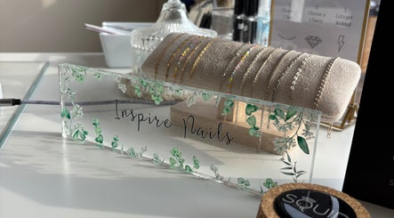 Elegant jewelry display at Inspire Nails, Studley, England, GB showcasing delicate bracelets and stylish decor.