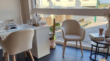 Bright, modern nail studio at Inspire Nails in Studley, England, GB with comfortable seating and plant decor.