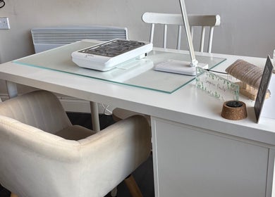 Modern nail station setup at Inspire Nails, Studley, England, GB with manicure equipment and elegant decor.