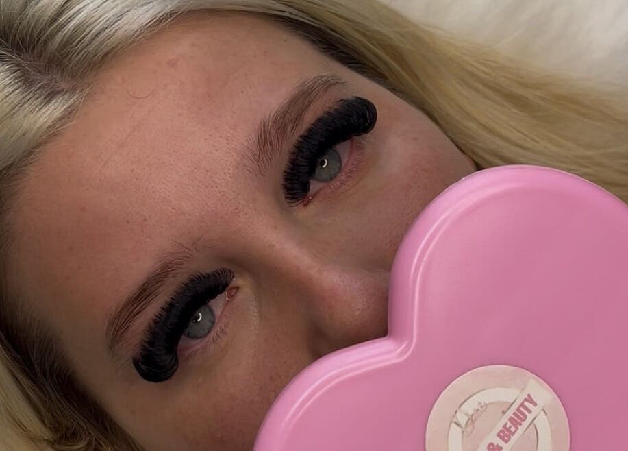 Lush lashes styled at Deebeautystop, London, England, GB with a pink heart-shaped mirror.