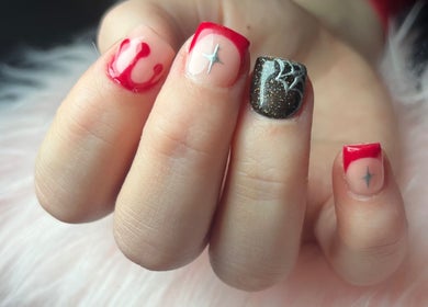 Stylish nail art featuring red designs at Nails by Freya (Prestatyn), located in Prestatyn, Wales, GB.