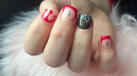 Stylish nail art featuring red designs at Nails by Freya (Prestatyn), located in Prestatyn, Wales, GB.