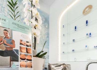 Evolve X poster and orchids at Starlight Med Spa Toronto, Toronto, Ontario, CA. Promotes body transformation.