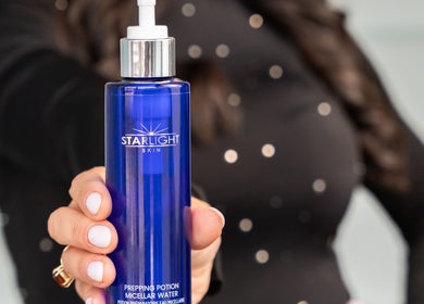Hand holding Starlight Skin Micellar Water at Starlight Med Spa Toronto, Ontario, CA.