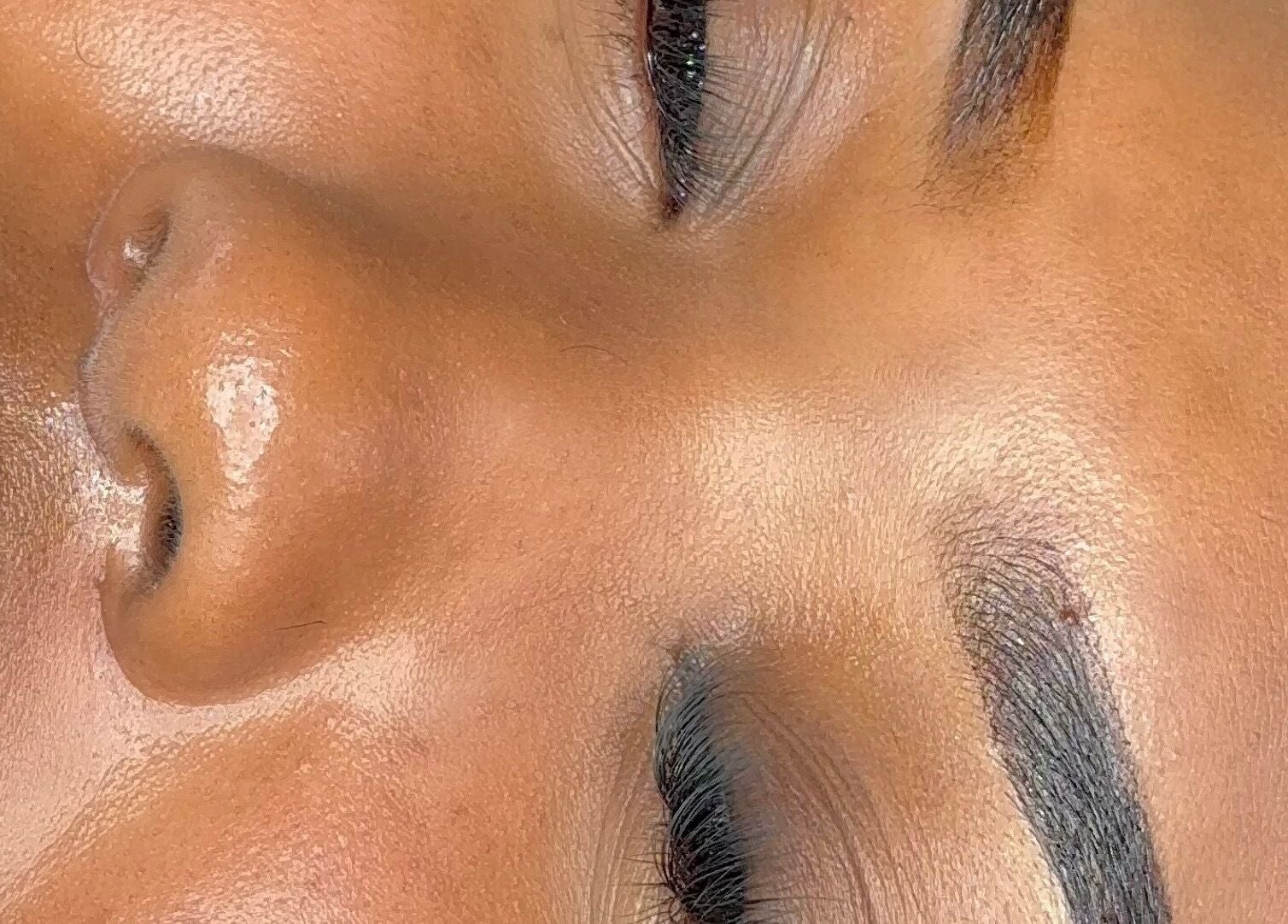 Close-up of serene face with glowing skin at Essence Oasis Salon and Spa, Saint John's, Saint John, AG.