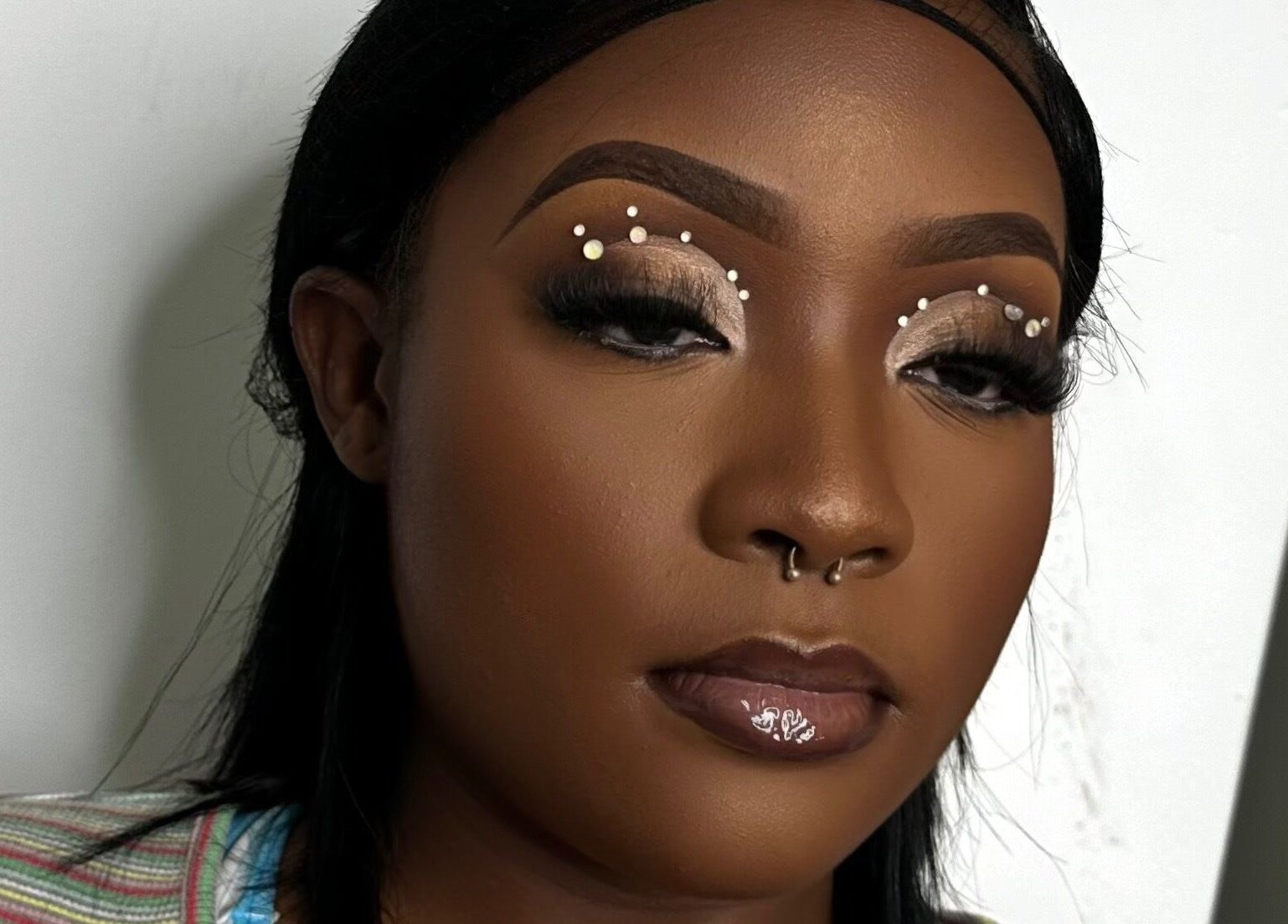 Elegant makeup with gem accents from Essence Oasis Salon and Spa, Saint John's, Saint John, AG.