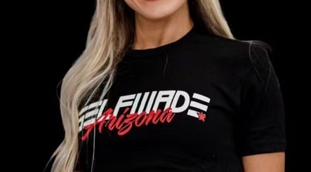 Woman wearing Arizona-themed shirt at Raneem Fitness, Scottsdale, Arizona, US.