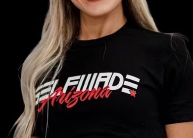 Close-up of a stylish black t-shirt promoting Raneem Fitness in Scottsdale, Arizona, US.